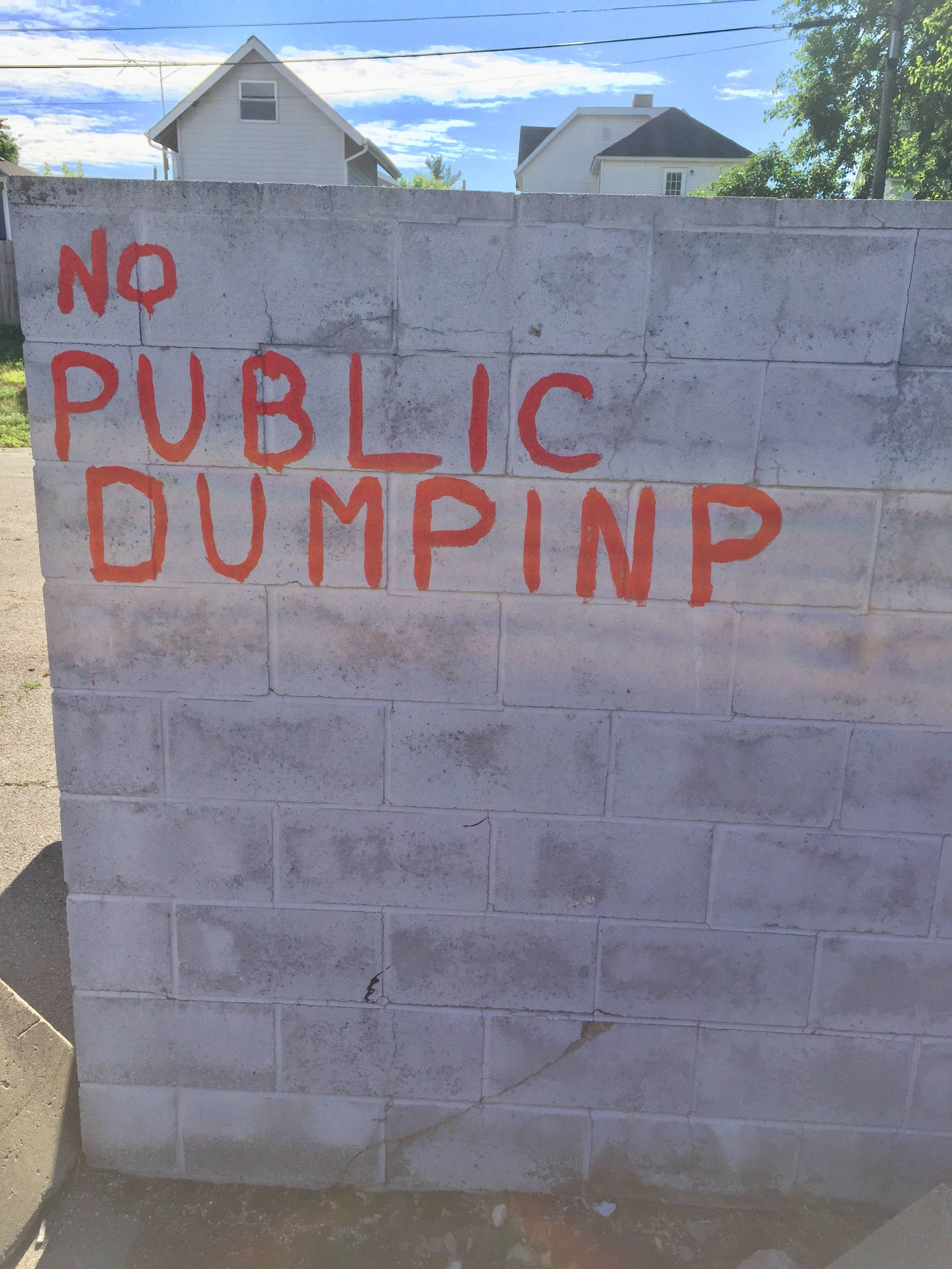 Homemade sign that says "No Public Dumping."